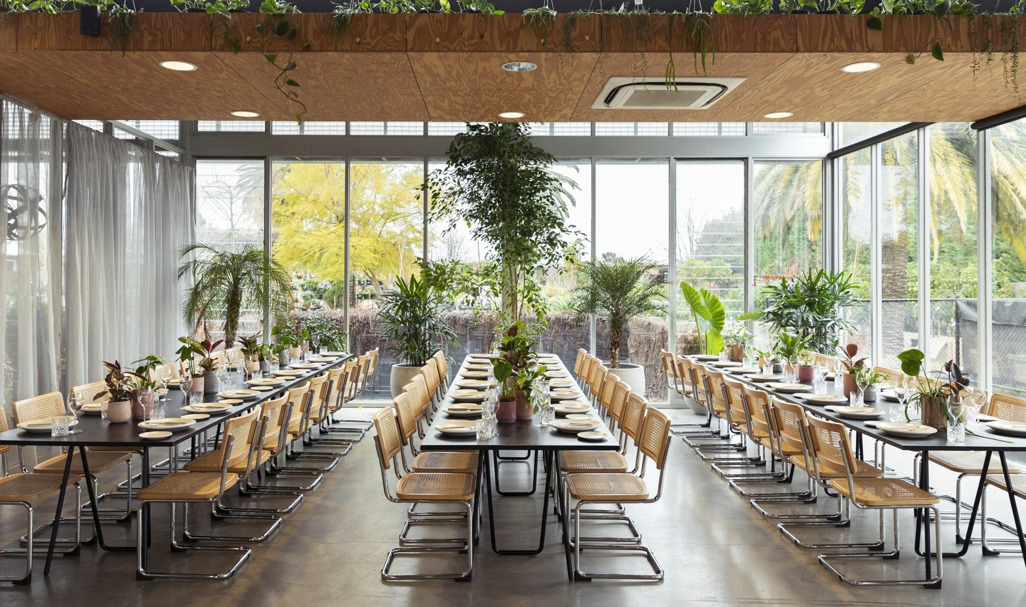 Grow Event Space main room, with three long tables styled.